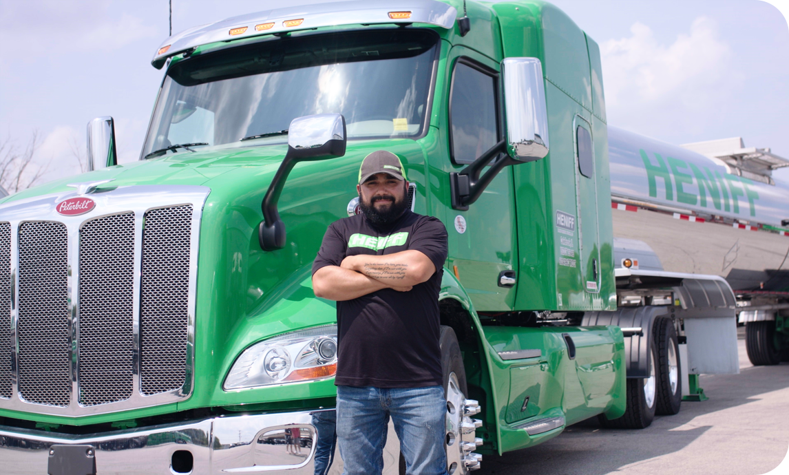 Man with t-shirt in front of his semi-truck