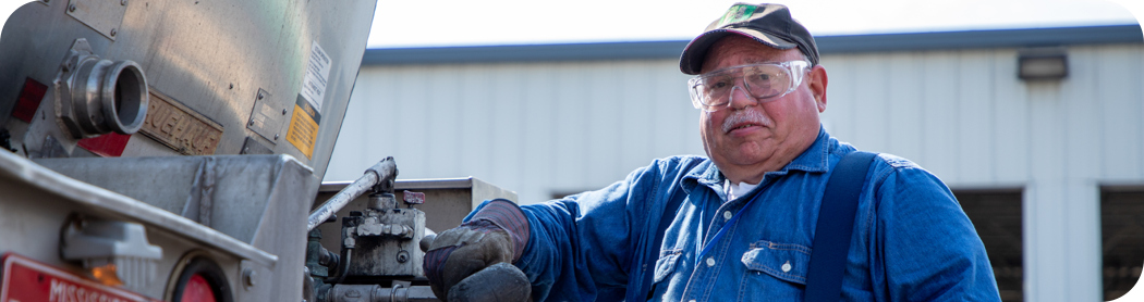 A man working on his semi-truck