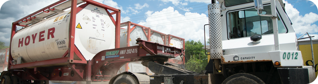 A truck hauling tankers